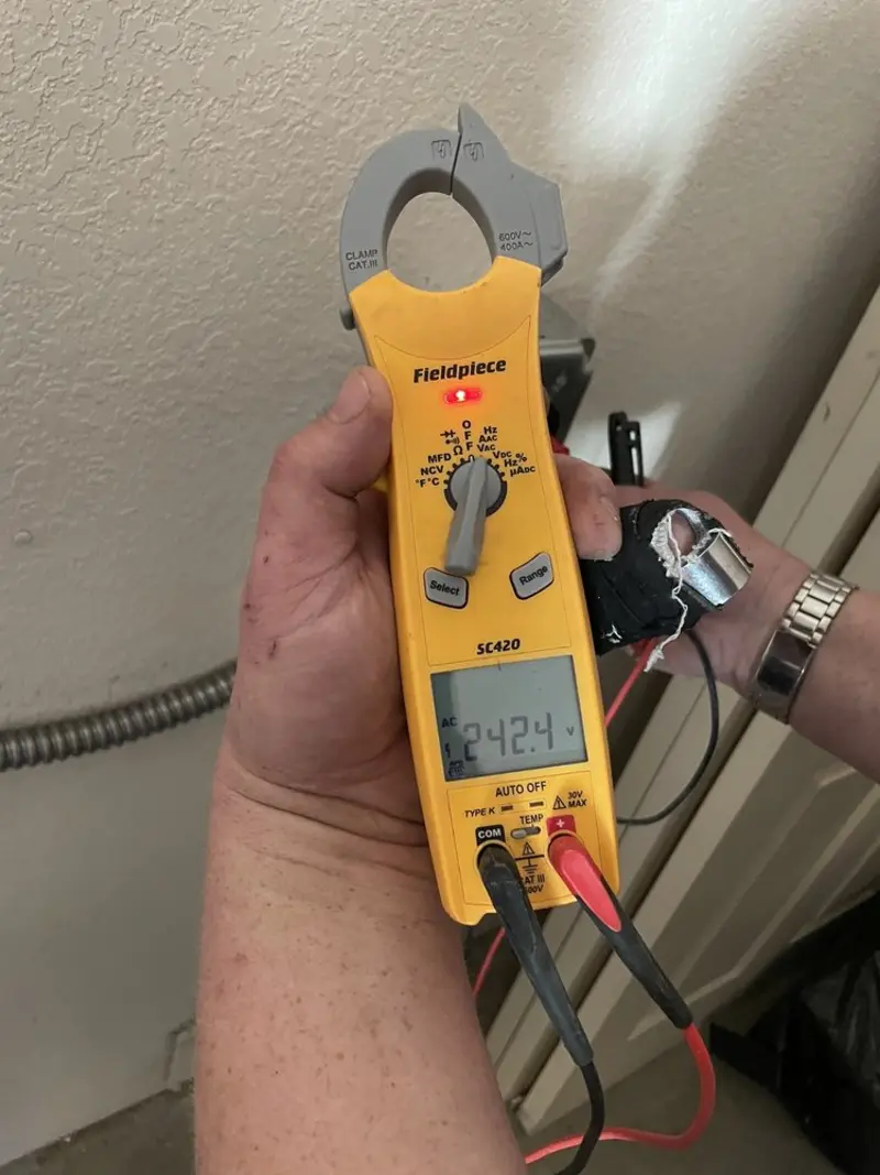 Voltage testing with clamp meter during Ceiling Fan Installation in Red Wing